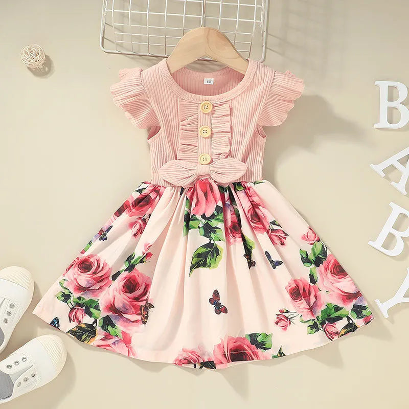 Toddler girl in a sleeveless summer dress, shown in one of six available colours.