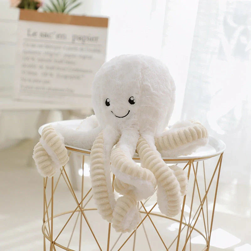 Soft, cuddly plush octopus toy with detailed facial features and flexible tentacles