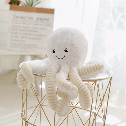 Soft, cuddly plush octopus toy with detailed facial features and flexible tentacles