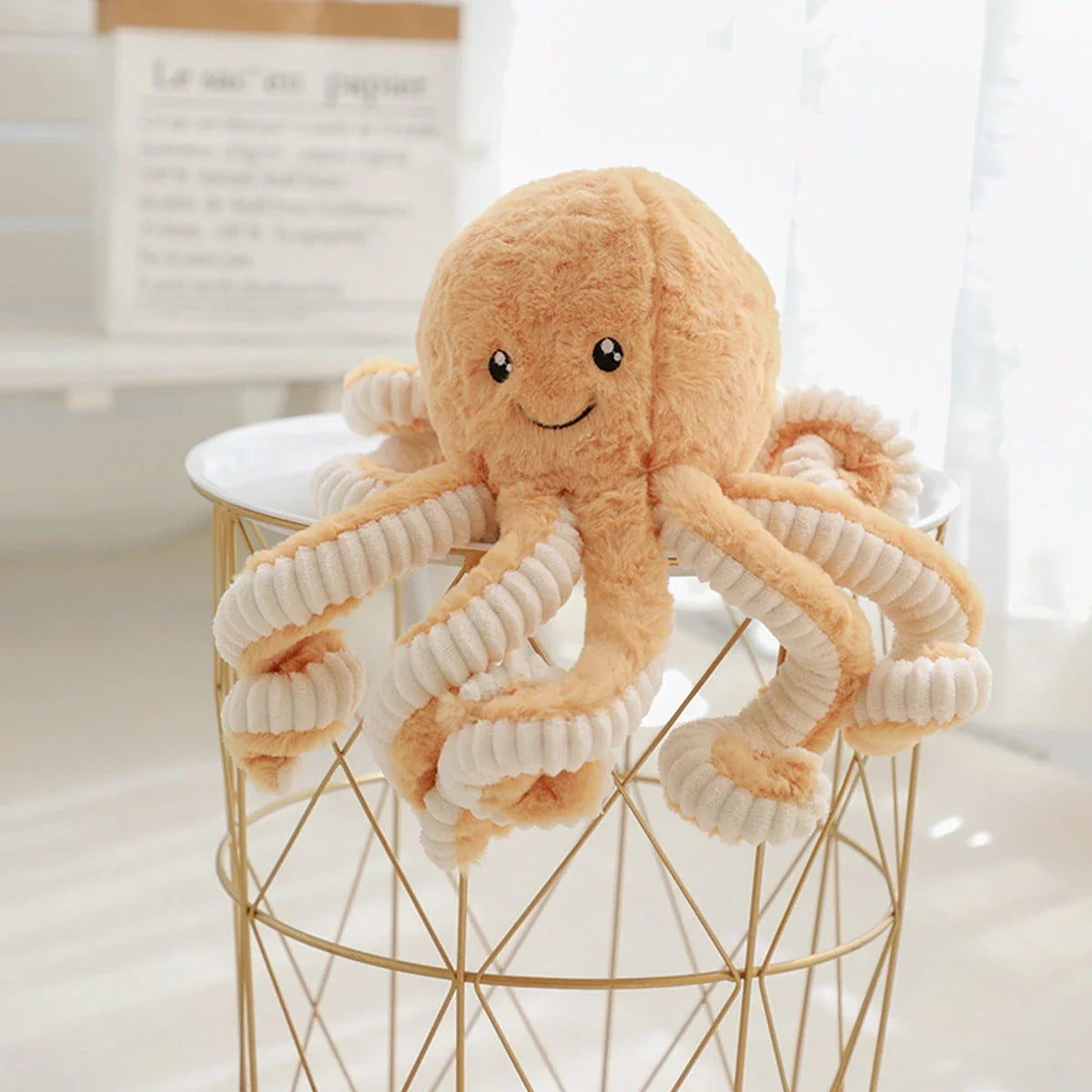 Soft, cuddly plush octopus toy with detailed facial features and flexible tentacles