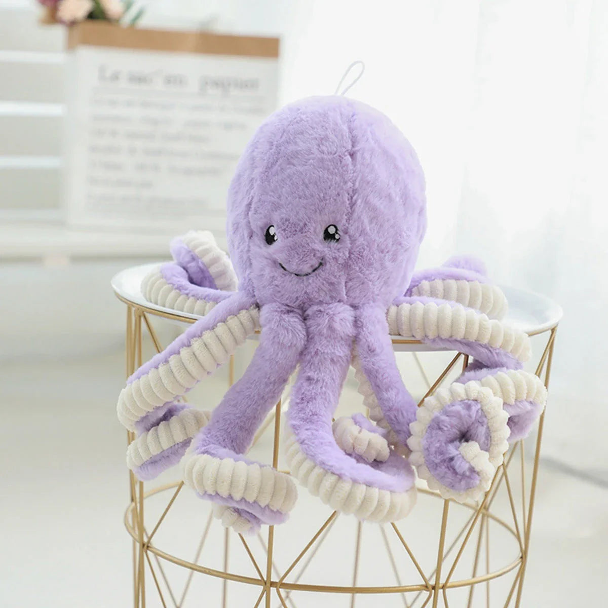 Soft, cuddly plush octopus toy with detailed facial features and flexible tentacles