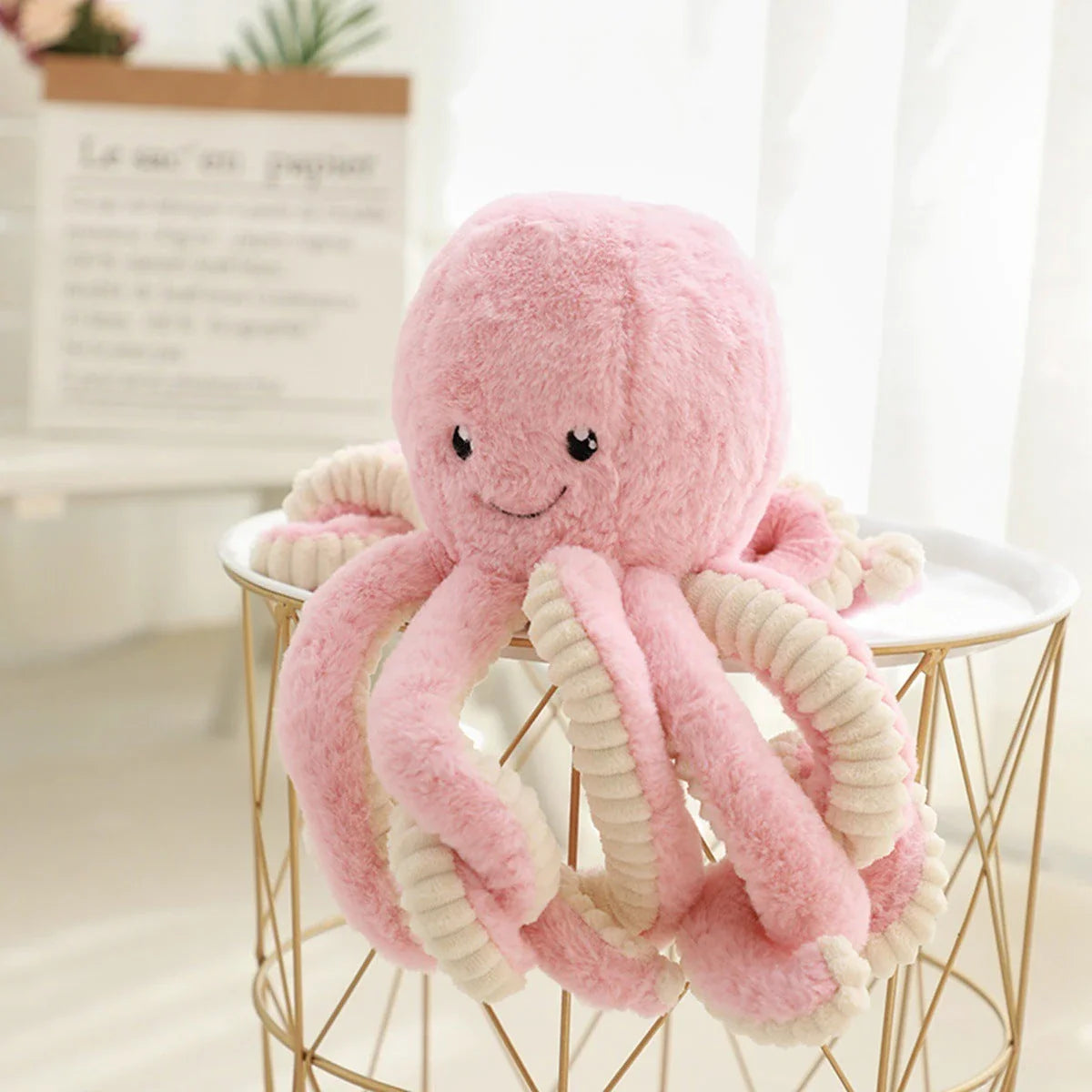 Soft, cuddly plush octopus toy with detailed facial features and flexible tentacles