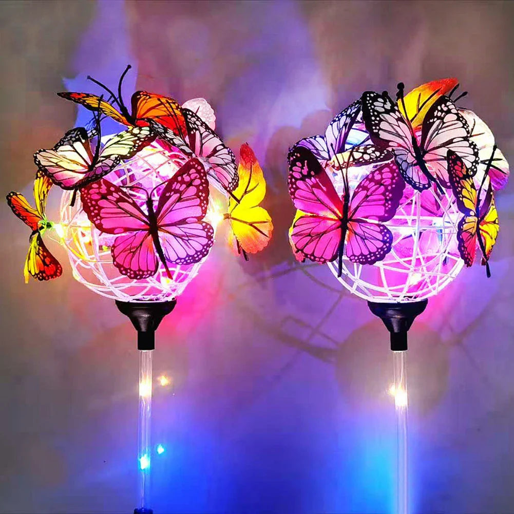 Solar-powered LED butterfly garden lights in black and transparent colors, creating a magical outdoor lighting display