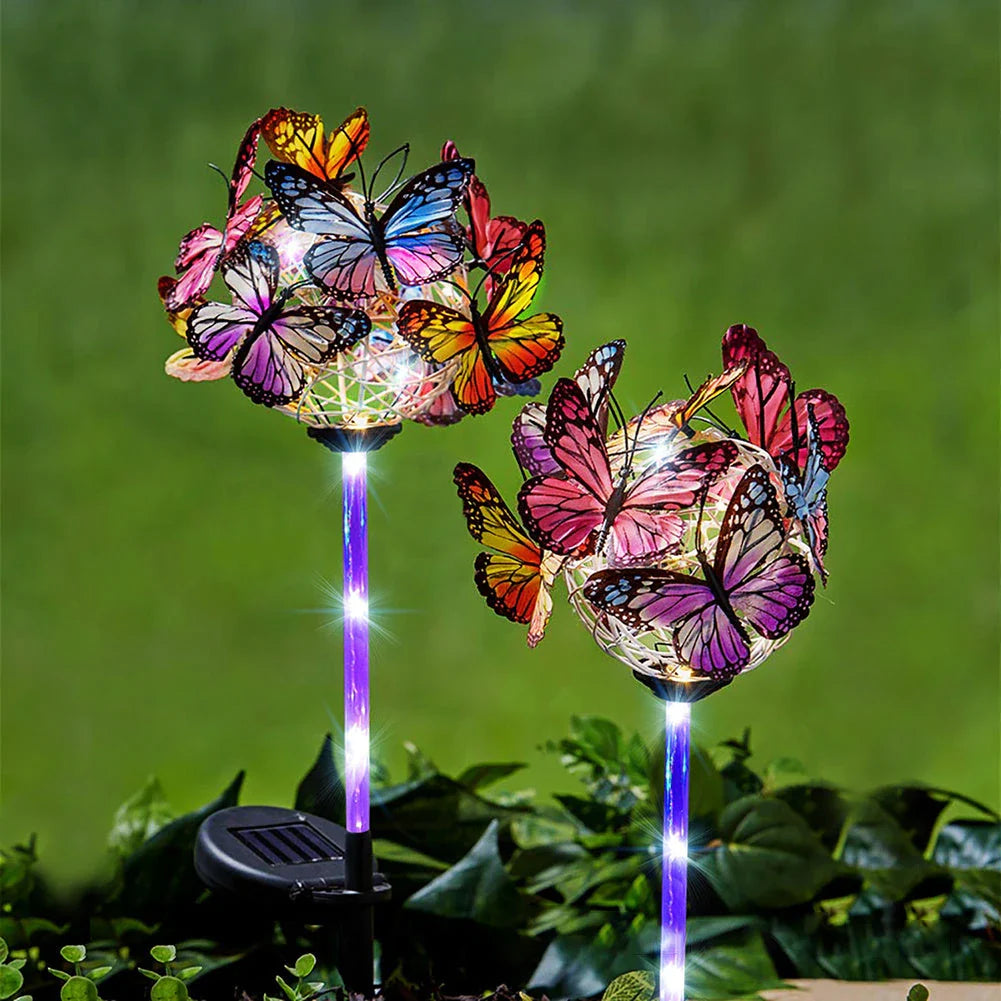 Solar-powered LED butterfly garden lights in black and transparent colors, creating a magical outdoor lighting display