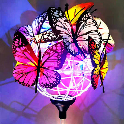 Solar-powered LED butterfly garden lights in black and transparent colors, creating a magical outdoor lighting display
