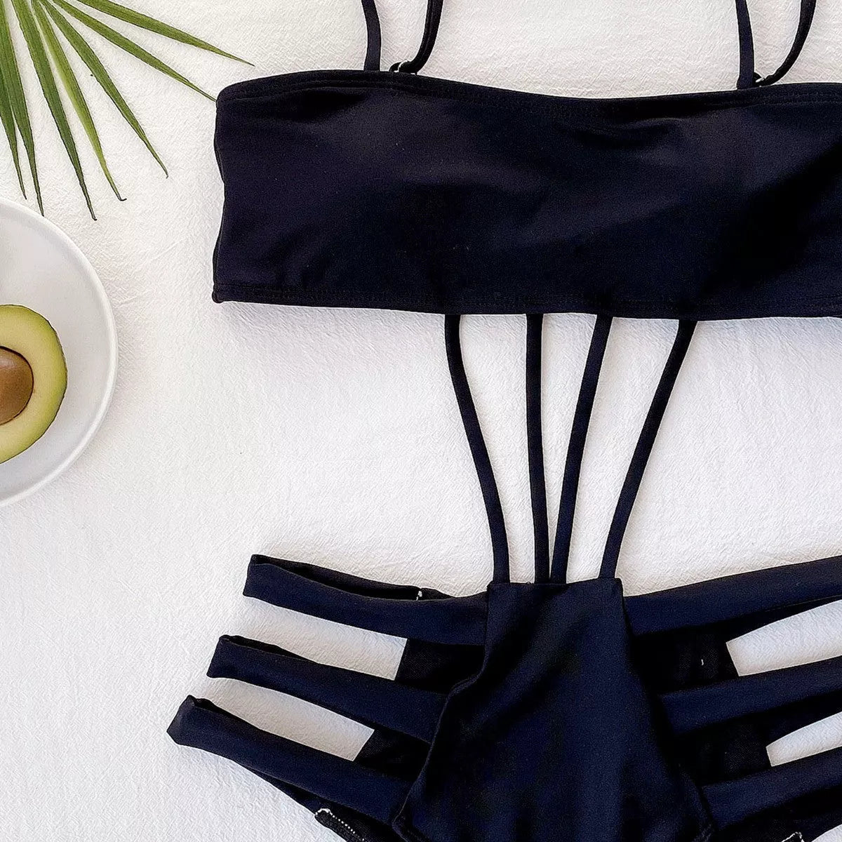 Black strappy one-piece swimsuit for women with adjustable fit