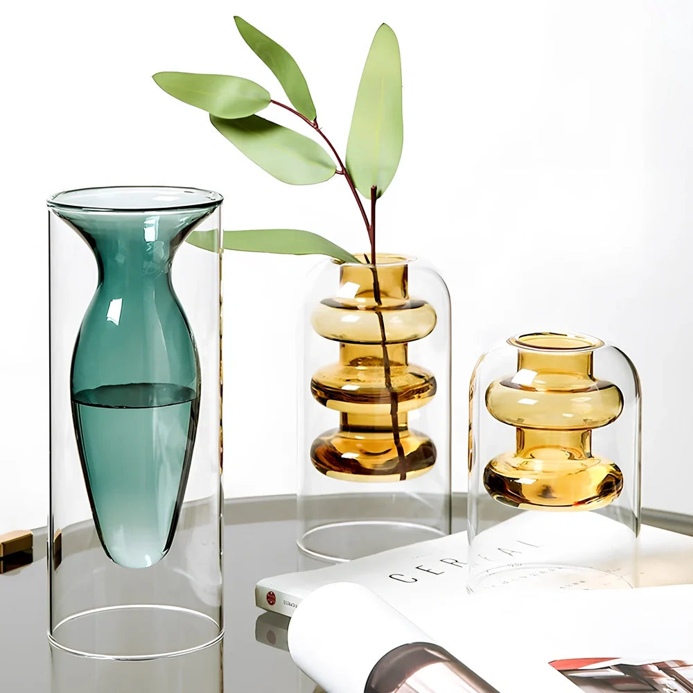 Transparent glass vase with colourful inner layer displaying dried flowers, 15cm tall on wooden table