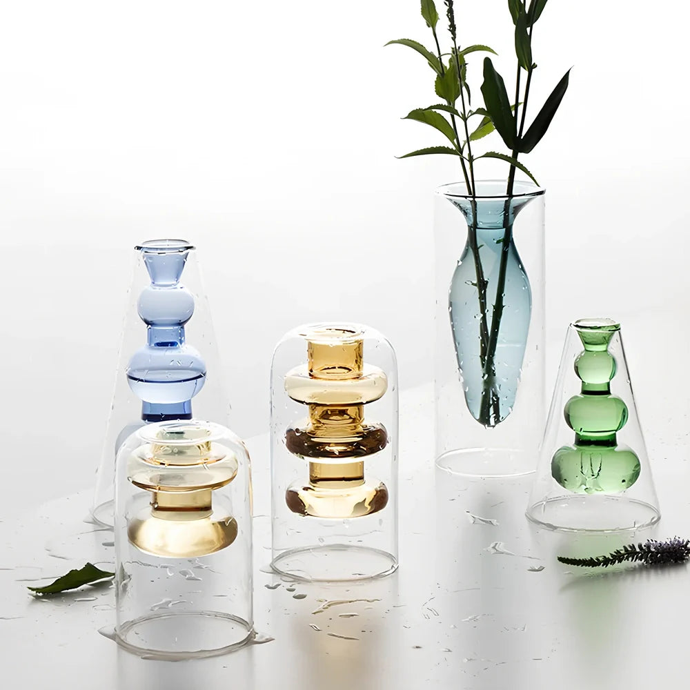 Transparent glass vase with colourful inner layer displaying dried flowers, 15cm tall on wooden table