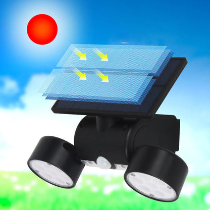 White solar garden light with two adjustable spotlight heads mounted on stake