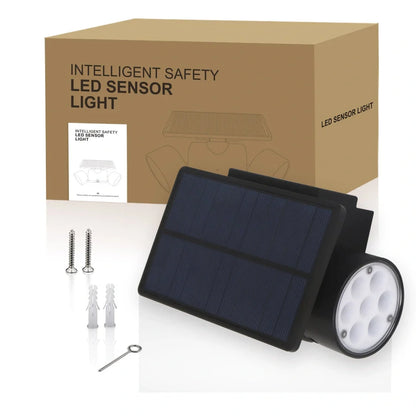 White solar garden light with two adjustable spotlight heads mounted on stake