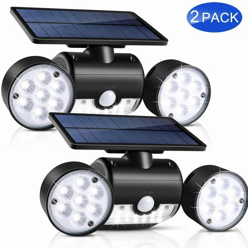 White solar garden light with two adjustable spotlight heads mounted on stake