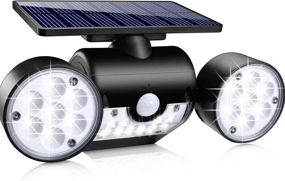 White solar garden light with two adjustable spotlight heads mounted on stake