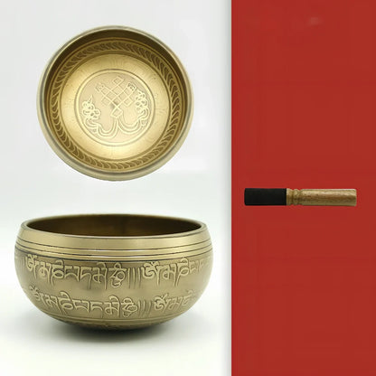 Copper meditation singing bowl with auspicious knot pattern and leather striker
