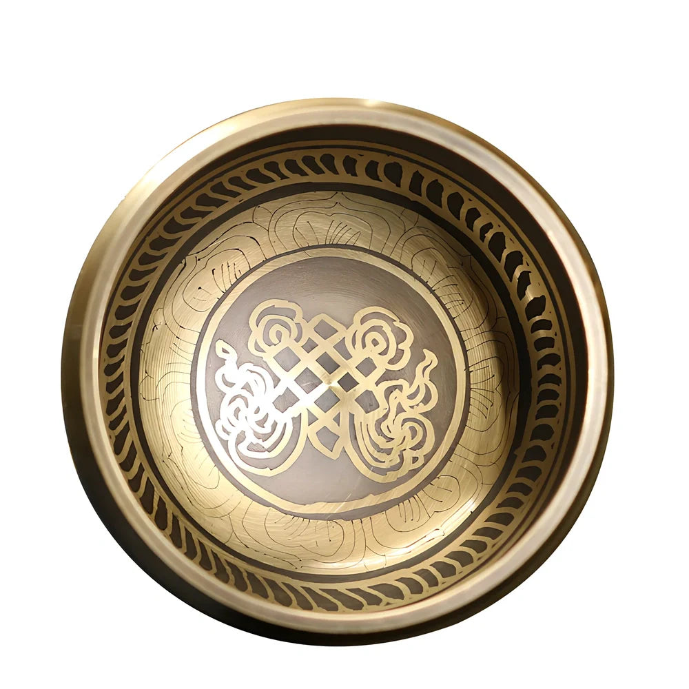 Copper meditation singing bowl with auspicious knot pattern and leather striker