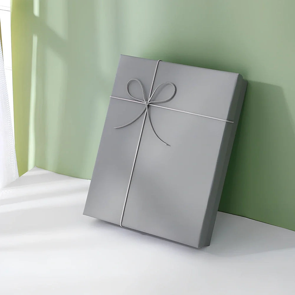 Rectangular gift box showing blue cover with white background, demonstrating thick cardboard construction and clean edges