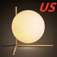 Clear glass spherical table lamp with aluminium base showing dual-colour LED lighting options