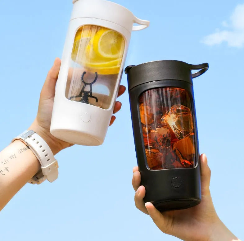 Portable automatic juice blender cup in black, blue, pink, or white, showing 650ml capacity and compact size.