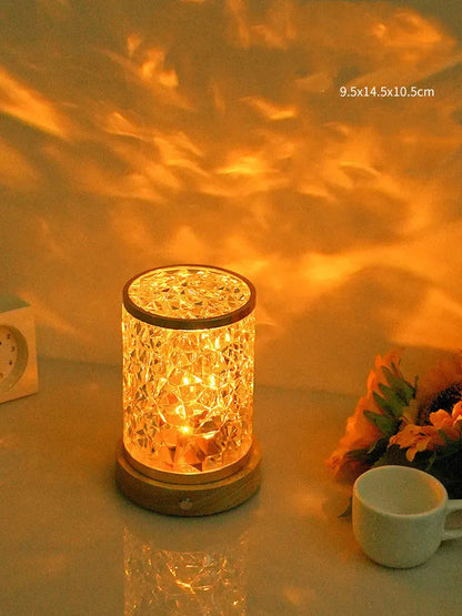 Rotating water ripple night light with acrylic construction and solid wood base measuring 9.5x14.5x10.5cm