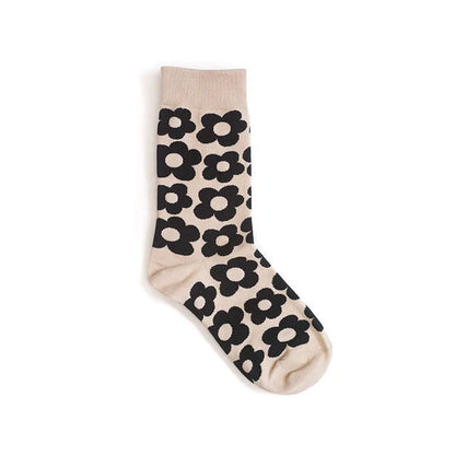 Cozy cotton socks featuring a playful cartoon flower pattern, designed for breathability and comfort.