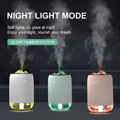 Compact cylindrical USB humidifier with night light in white, pink, or green, showing mist output.