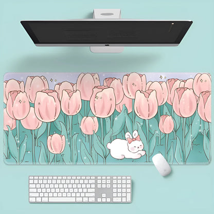 Large floral pattern mouse pad on a wooden desk with a computer mouse.