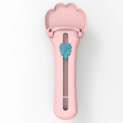 Green and pink pet food scoop and squeezer dispenser for cats and dogs.