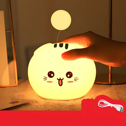 Silicone night light with fold-eared cat design showing LED illumination and USB charging port