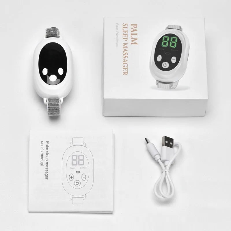 White handheld sleep aid remote control device with USB charging port on a bedside table.
