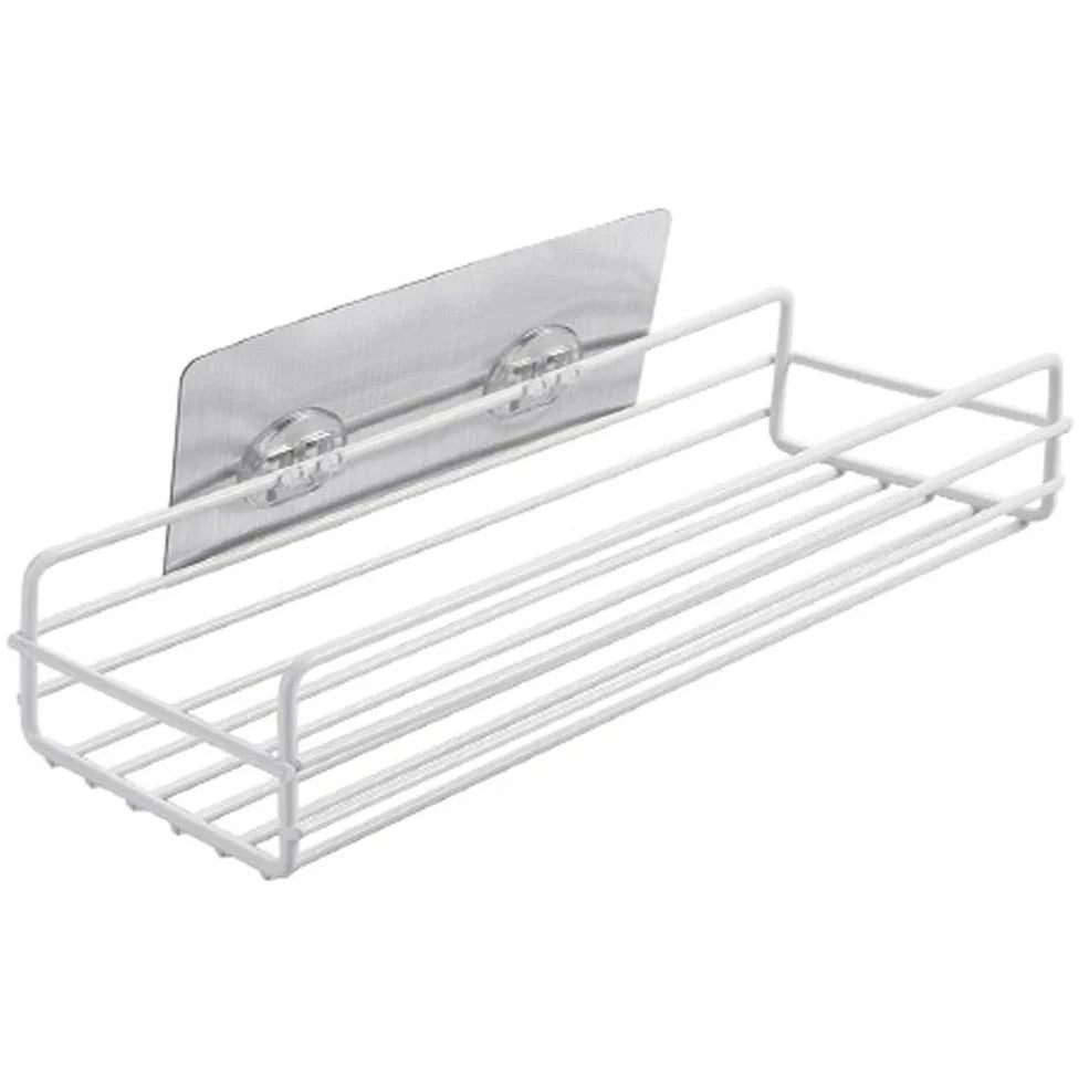 Black wrought iron bathroom shelf, 60cm long with drainage holes, holding shampoo bottles over tub edge