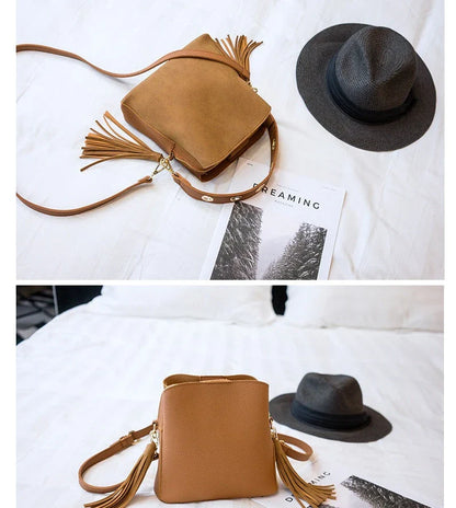 A stylish frosted tassel bucket bag with interior pockets and a versatile shoulder strap design
