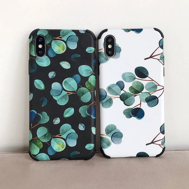 Black silicone iPhone case with a leaf pattern design on the back.