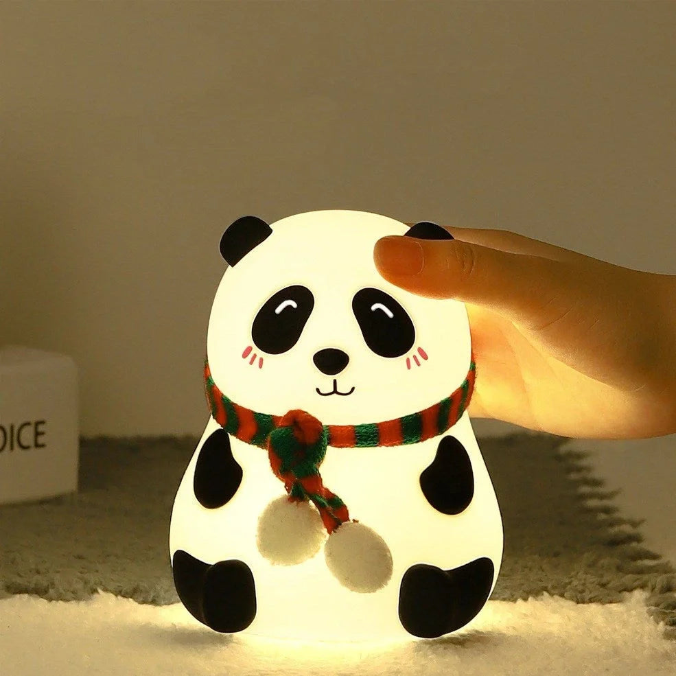 Panda-shaped silicone night light with soft white illumination, USB charging port visible