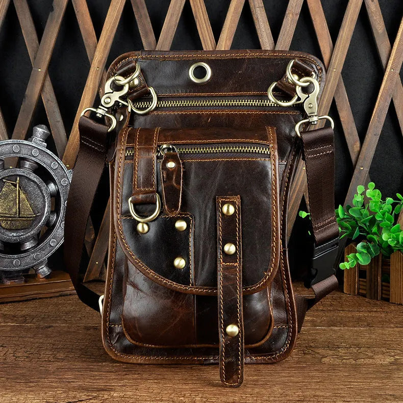 Men's black punk fanny pack with cowhide leather, zipper closure, and internal phone and ID compartments.