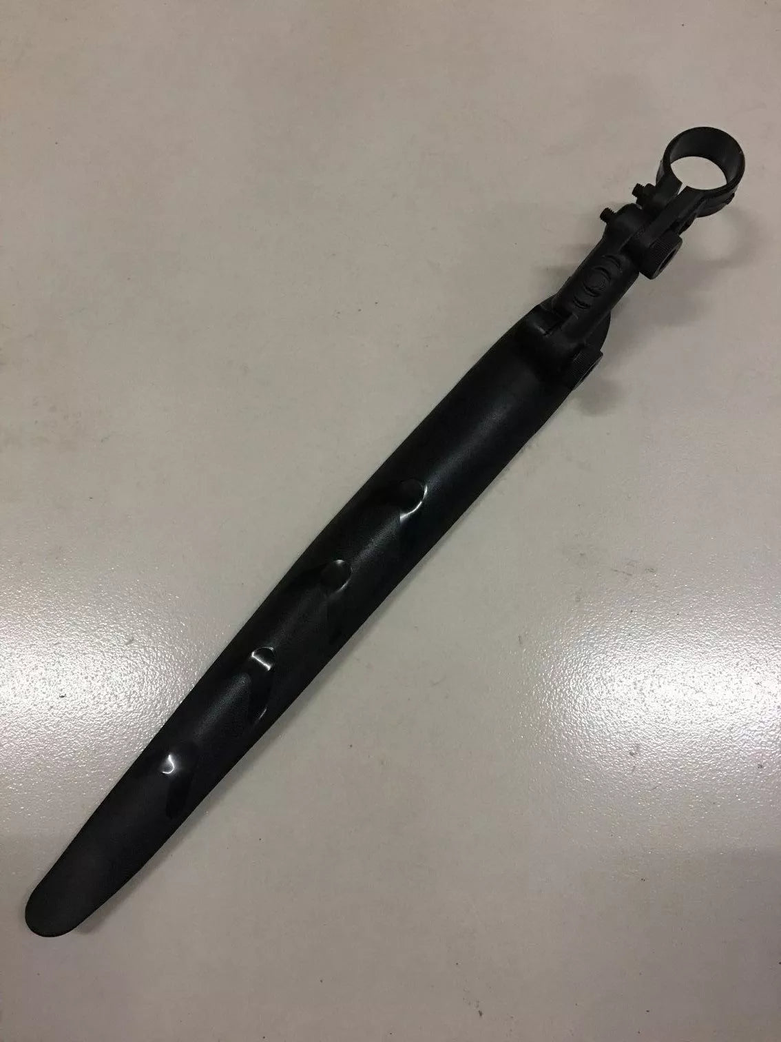 Road bike mudguard with durable plastic construction, perfect fit for clean rides