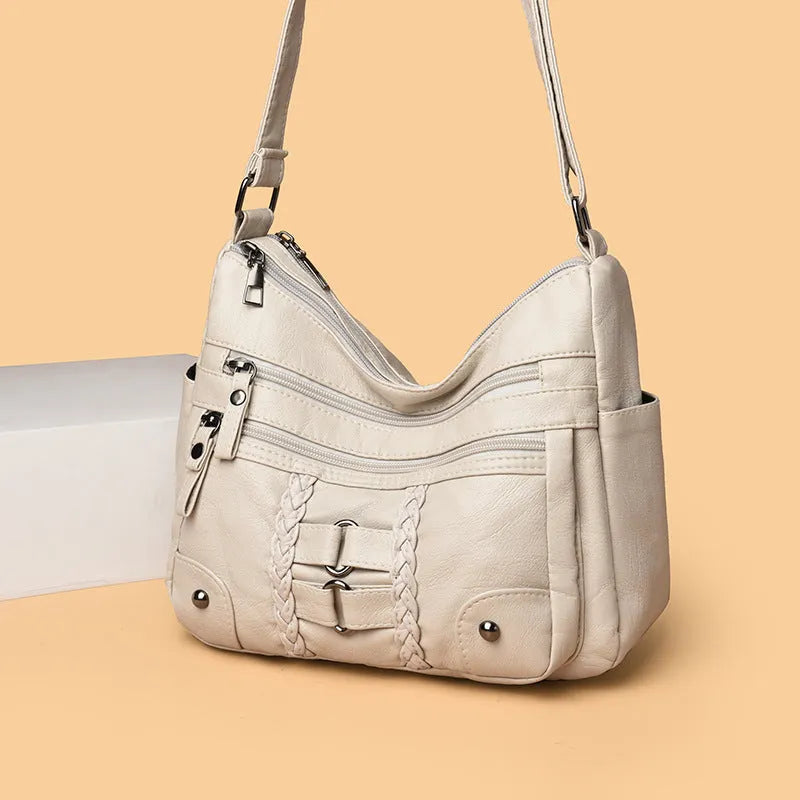 PU shoulder messenger bag with single strap, open outer pocket, and zip inner compartment in black, red, brown, or beige.