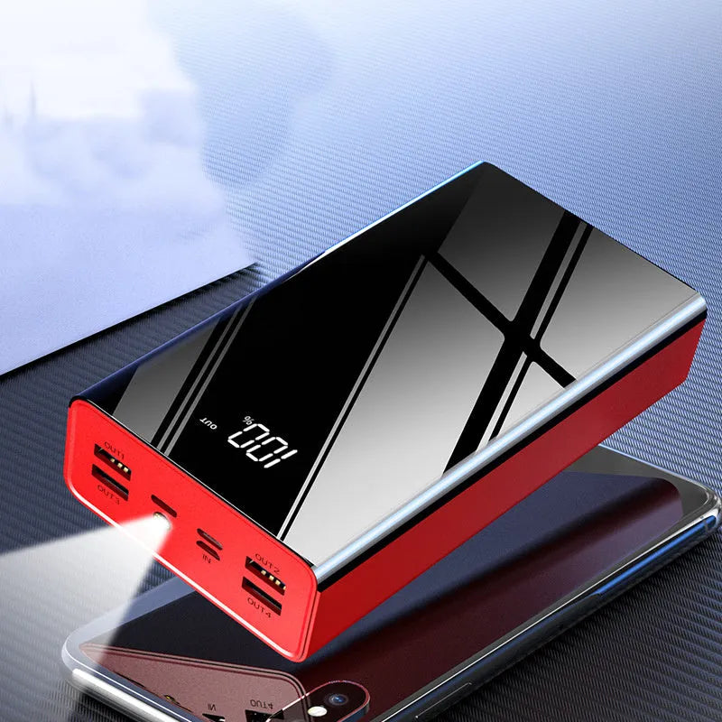 Large black and red 40000 mAh power bank with LCD display showing battery percentage