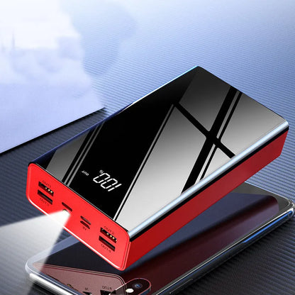 Large black and red 40000 mAh power bank with LCD display showing battery percentage
