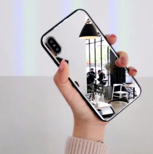 Black iPhone mirror phone case with built-in self-timer glass, compatible with iPhone 7 Plus, 8 Plus, and X models.