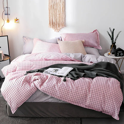 Pink polyester bedding set with twill weave duvet cover, pillowcases, and deep pocket fitted sheet in UK sizes
