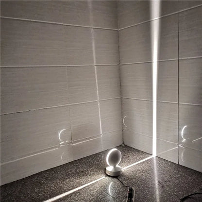 Aluminium and glass LED wall spotlight bar with colour change options, mounted on a corridor wall.