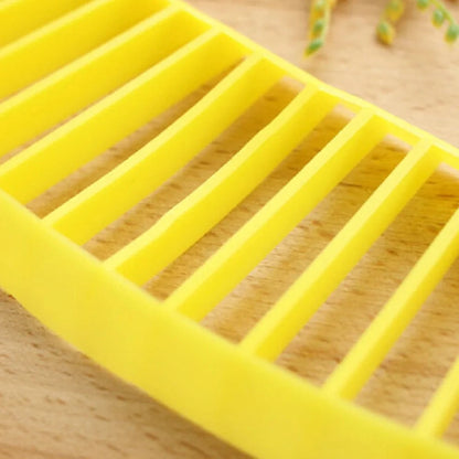 Yellow food grade PP banana cutter, 25 cm long, slices entire fruit in one quick motion for easy kitchen prep