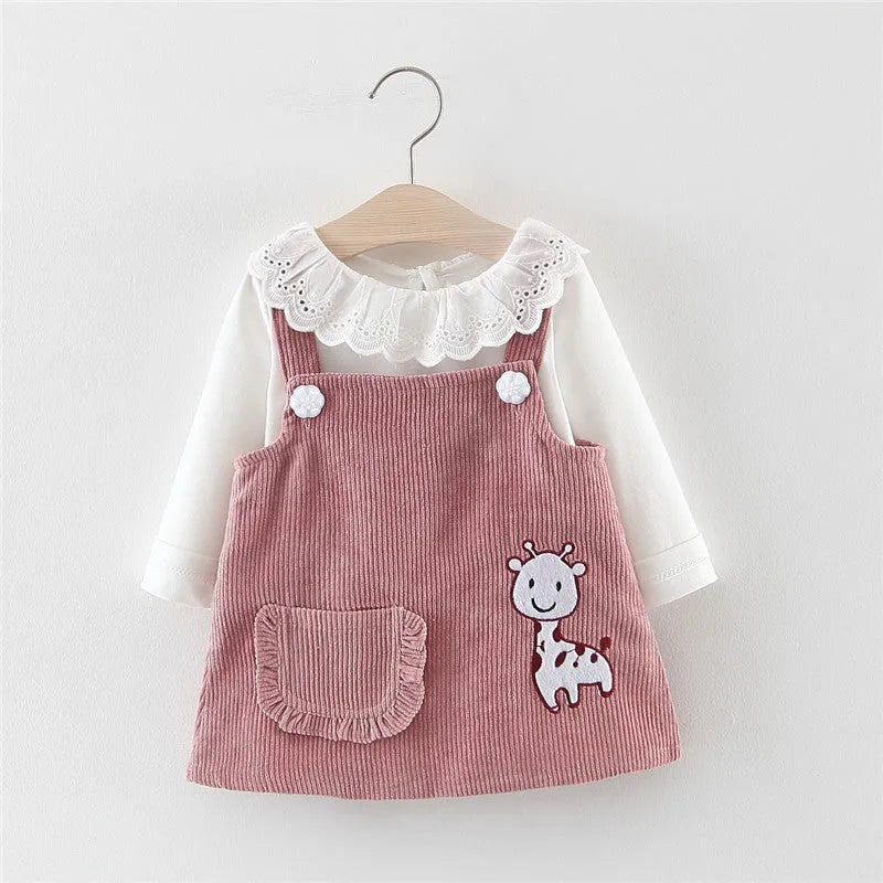 Baby girl two-piece cotton dress set with long-sleeve top and suspender skirt in yellow or pink.