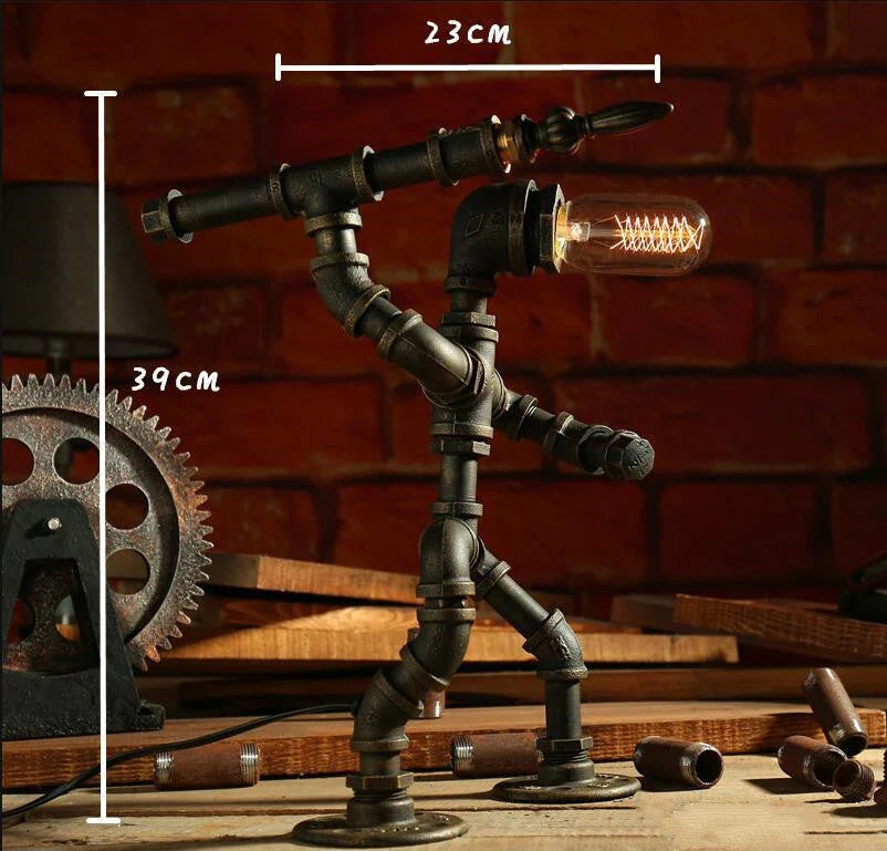 Vintage industrial iron pipe table lamp with soft, warm lighting and a green bronze finish