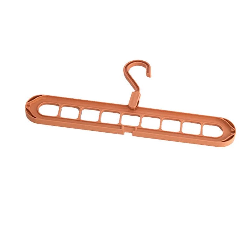 Green nine-hole folding hanger with trousers organised across nine hanging points, showing 45cm width