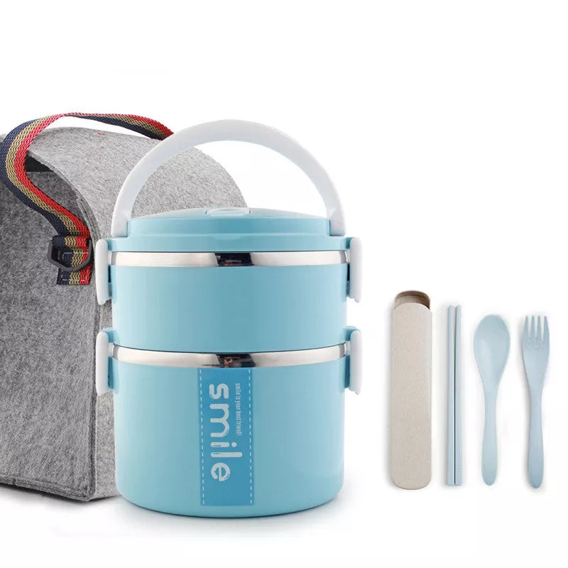 Stainless steel lunch box with built-in spoon, leak-proof design, available in green, pink, and blue