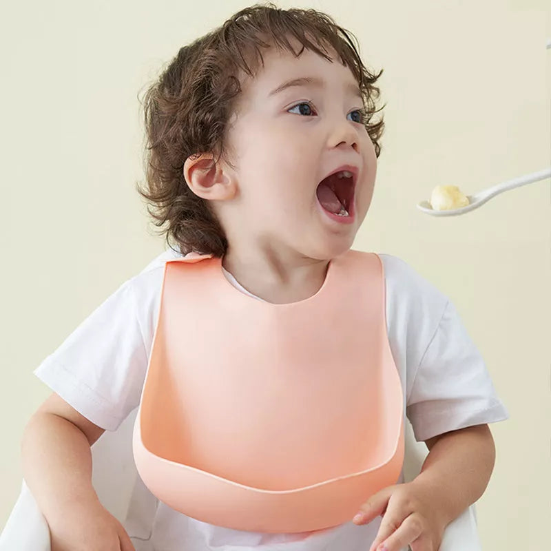 Soft waterproof silicone baby bib with food catcher in various colors