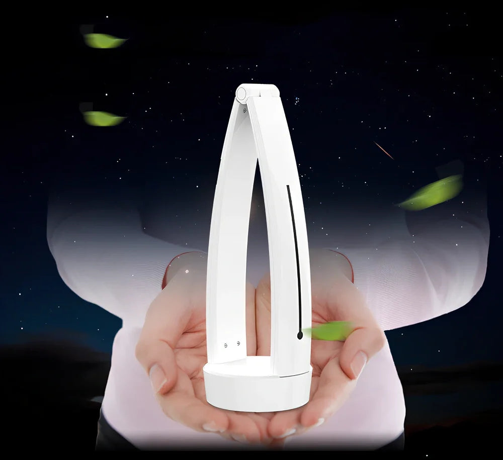 White folding LED desk lamp with touch control on wooden desk