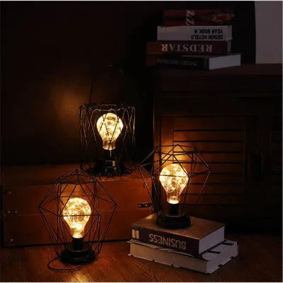 Minimalist hollow iron table lamp with warm white LED light in red wine glass design