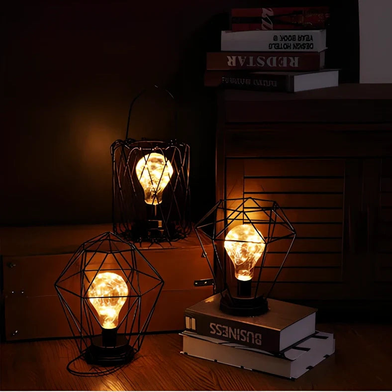 Minimalist hollow table lamp in red wine bottle design with wrought iron construction and warm white LED illumination