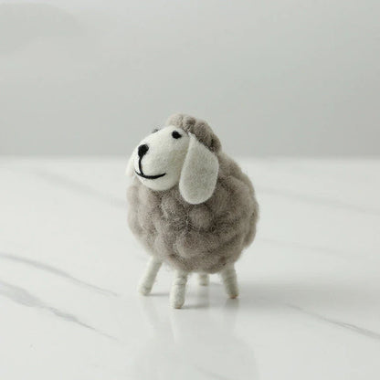 Adorable plush sheep decorations in various sizes and color combinations, perfect for adding a cozy, farmhouse-inspired touch to any home.